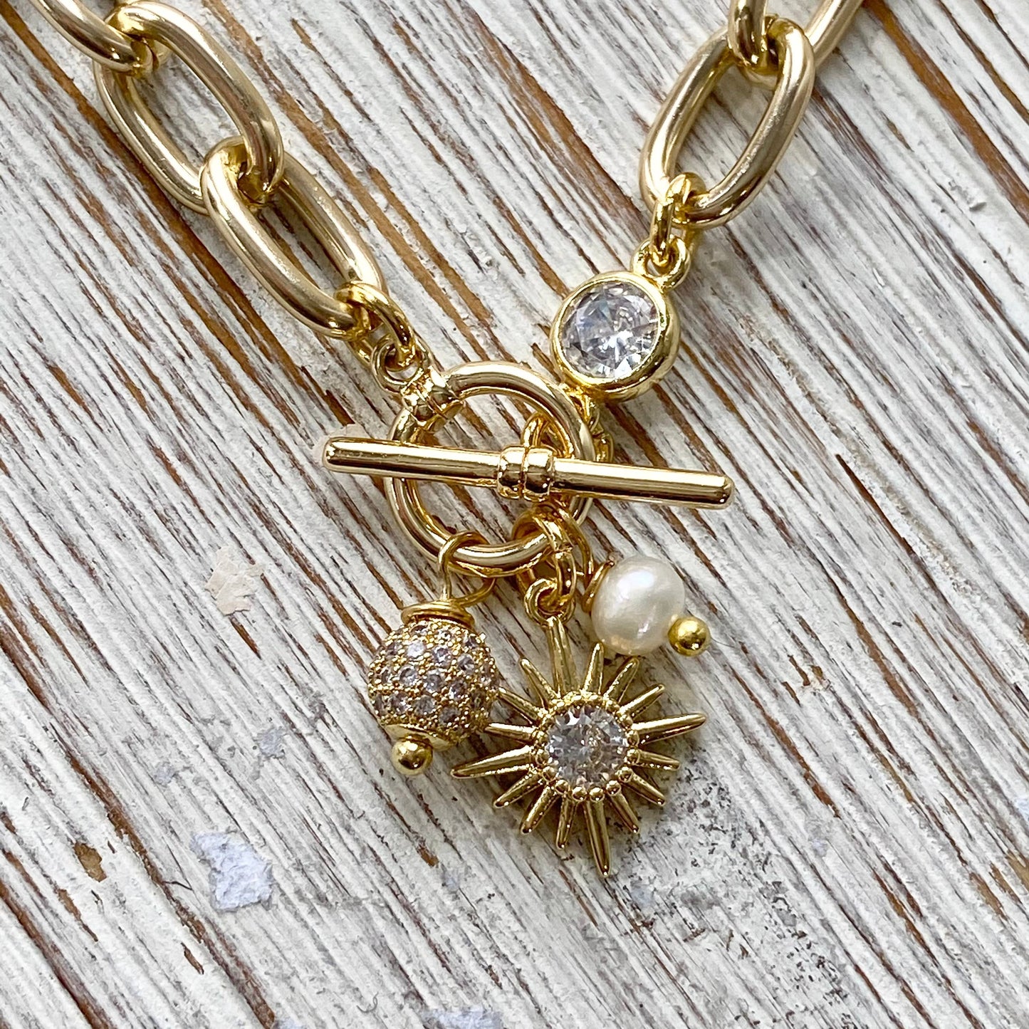 Chunky gold chain bracelet, sun, pearl