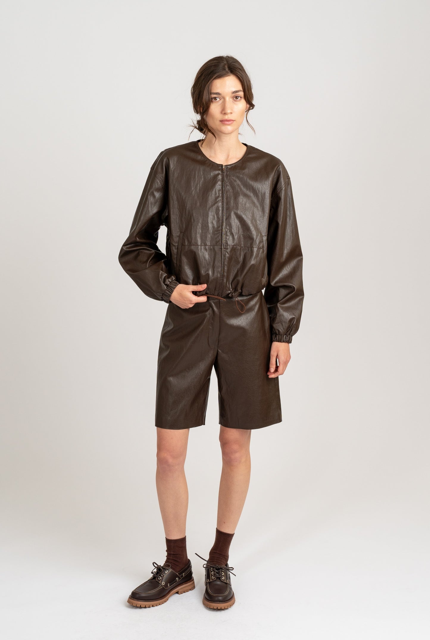 CREW NECK FAUX LEATHER JACKET W/ ELASTIC HEM