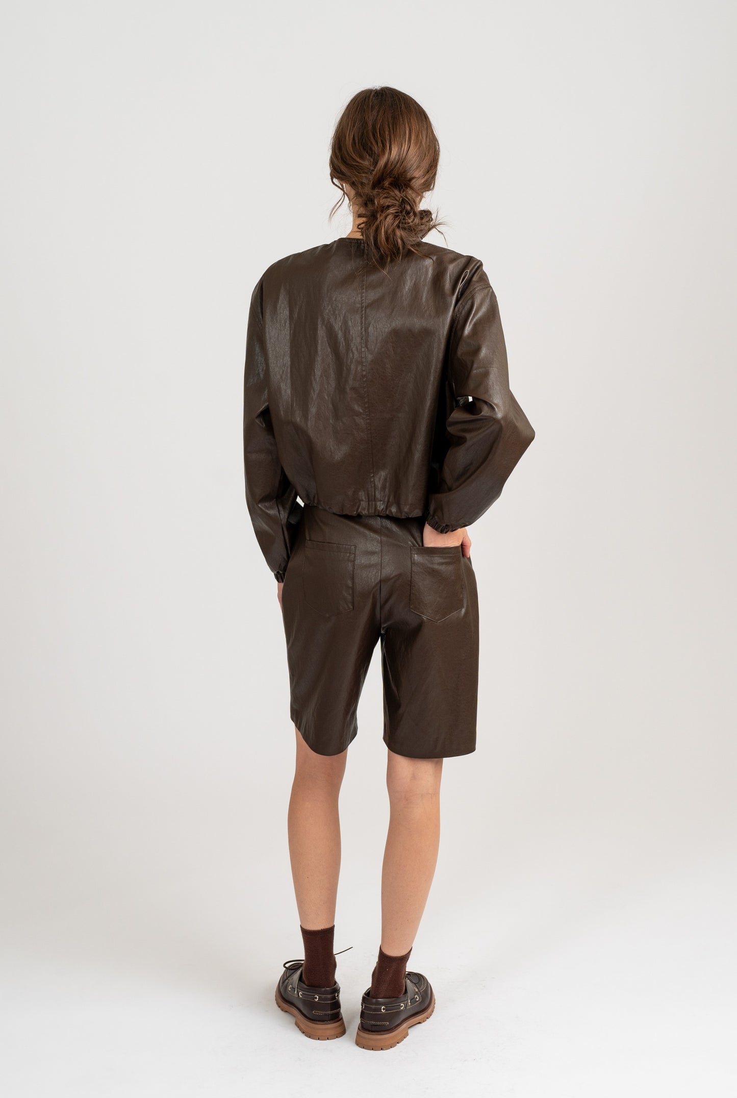 CREW NECK FAUX LEATHER JACKET W/ ELASTIC HEM